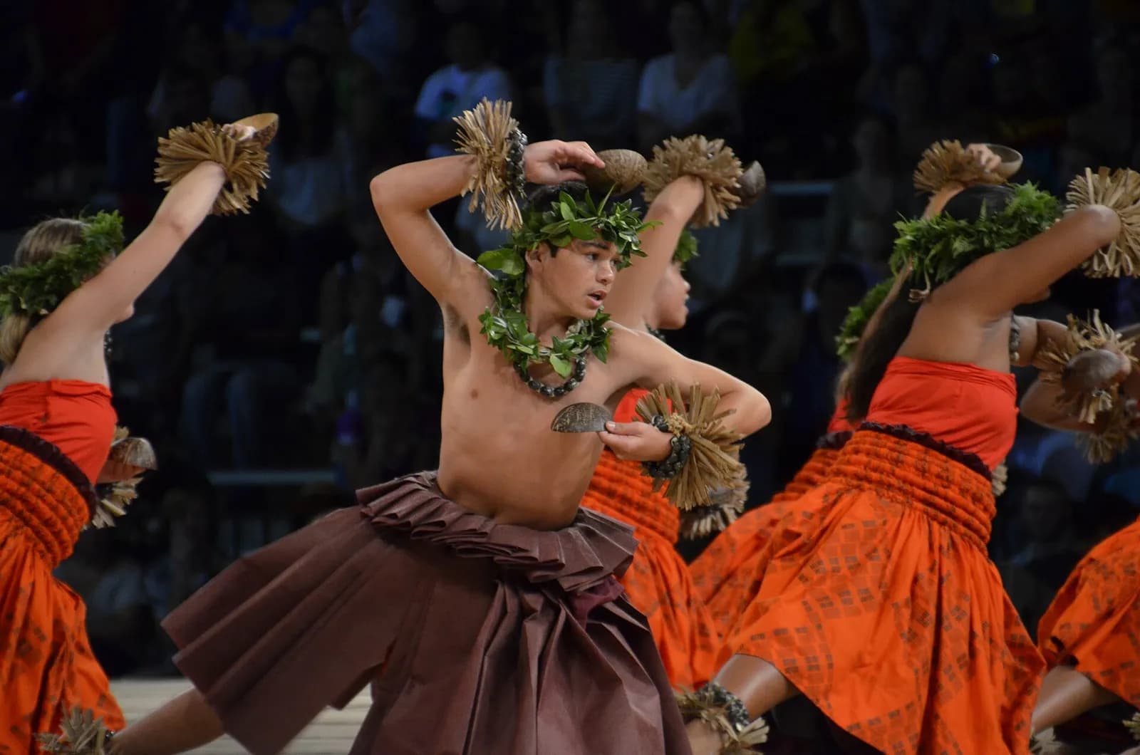 Hawaii: Hula kahiko dancers from Hālau o Kekuhi on stage at the Merrie Monarch Festival