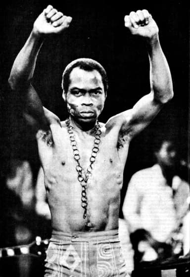 Fela Kuti: Fela Kuti photographed on stage. Distributed as a promotional photo in 1986.