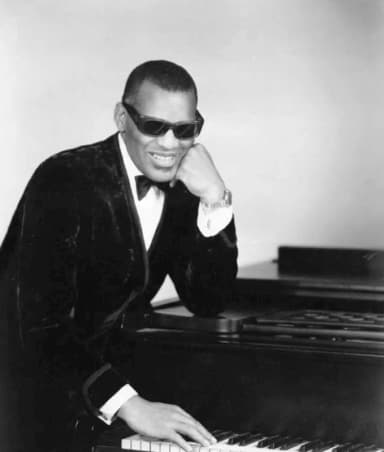 Ray Charles: Photo of Ray Charles in one of his classic poses at the piano.