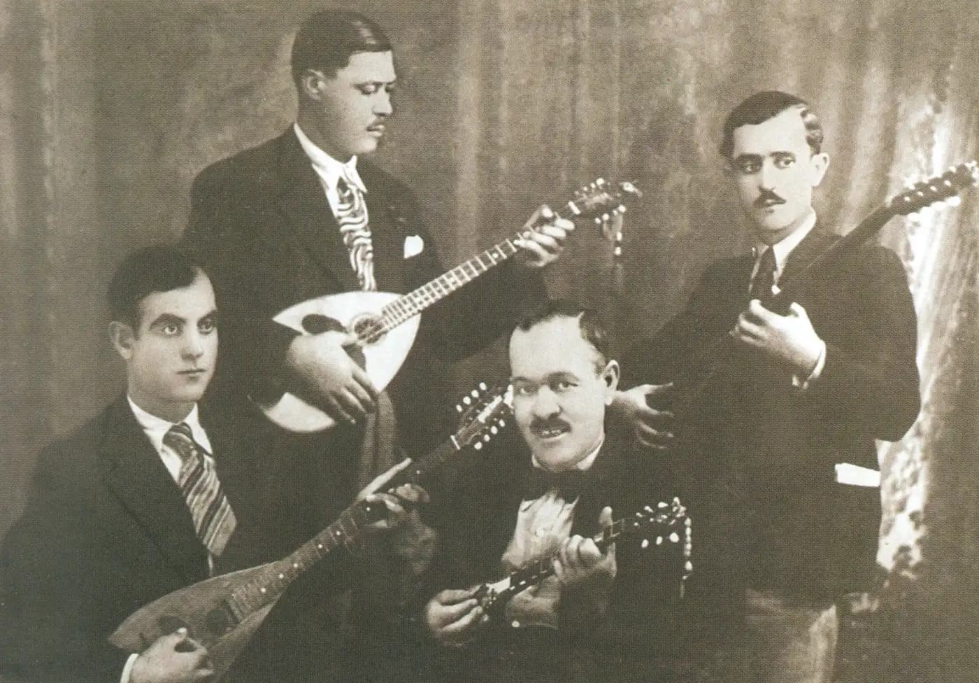 Greece: The Famous Quartet of Pireaus (members: Stratos Pagioumtzis, Markos Vamvakaris, Yiorgos Batis and Anestis Delias), photographed in about 1933; Greek rebetiko